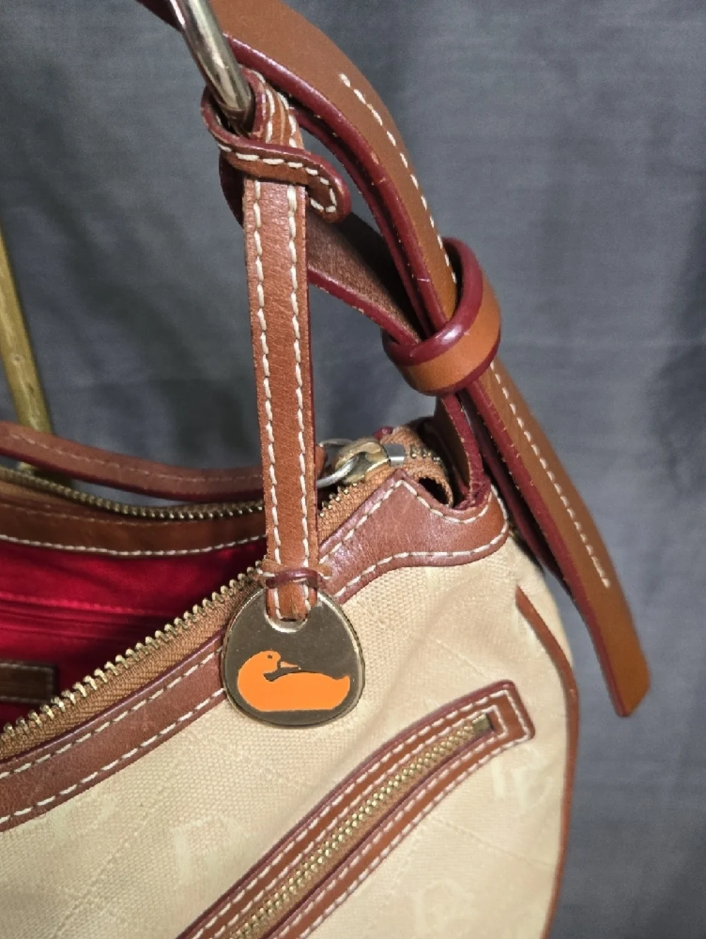 EUC Dooney & Bourke Beige and Brown Crescent Hobo with Orange Logo Charm